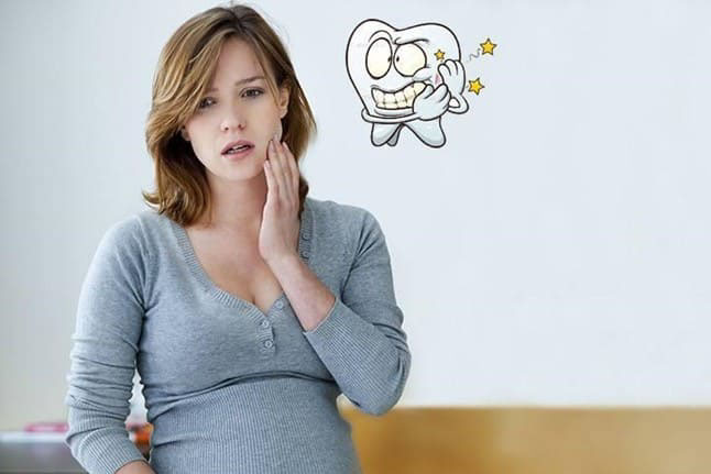 Thiếu canxi có thể khiến mẹ bầu bị đau răng
